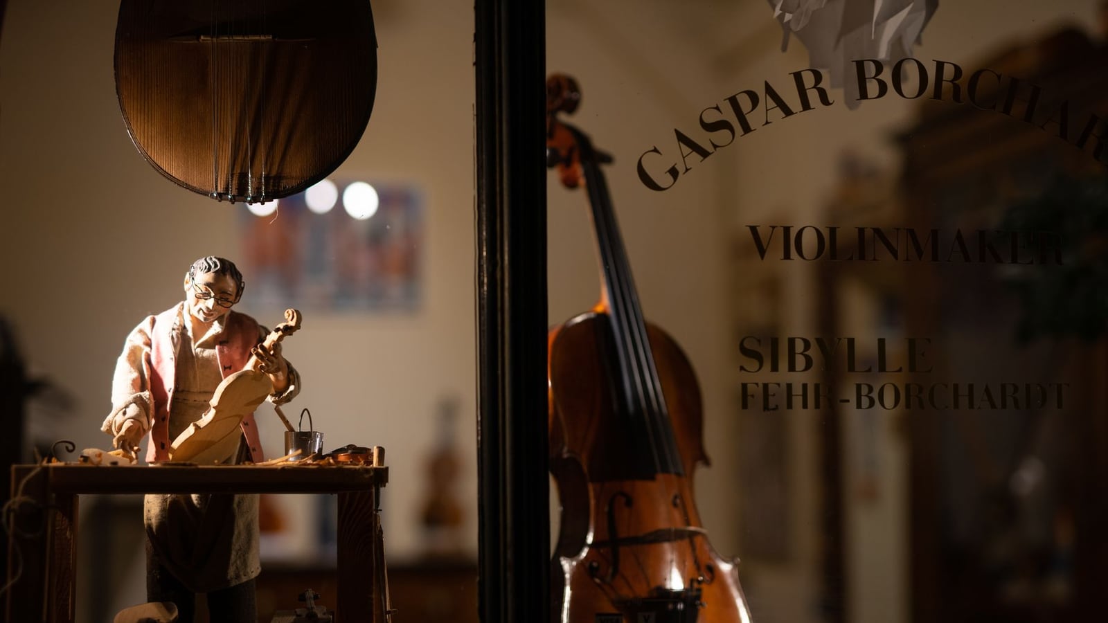 Interior view of the Basnetbase musical instrument workshop in Vienna with natural light and specialized tools.
